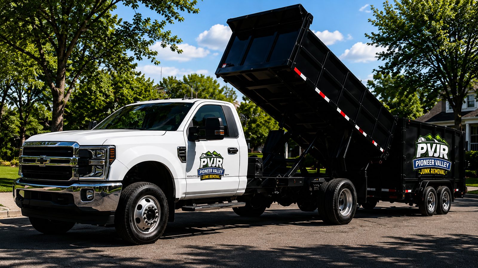 Pioneer Valley Junk Removal dump truck on a job